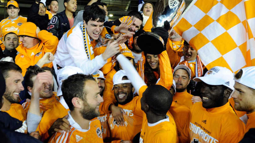 Houston Dynamo players celebrate winning a soccer match