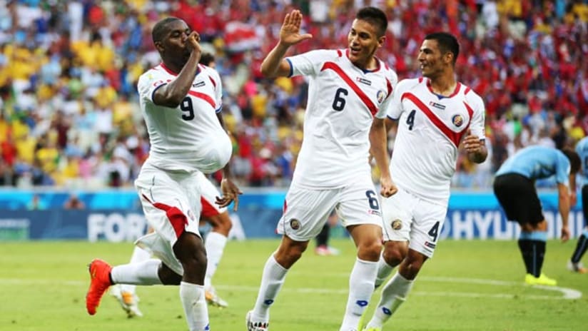 World Cup: Joel Campbell and Oscar Duarte celebrate a Costa Rica goal vs. Uruguay.
