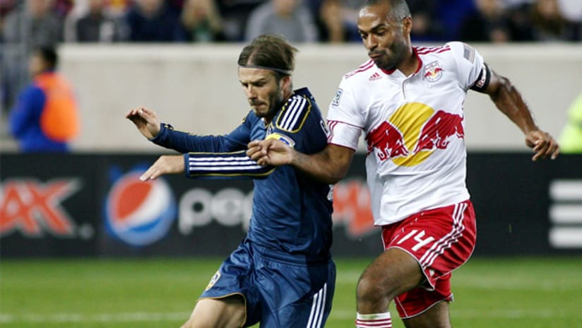 LA's David Beckham and RBNY's Thierry Henry vie for possession.