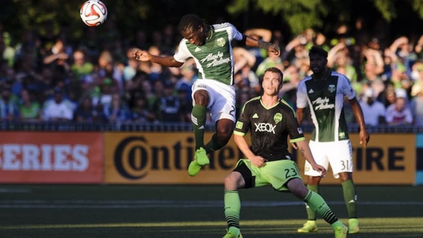 Diego Chara heads the ball in a US Open Cup game against Seattle