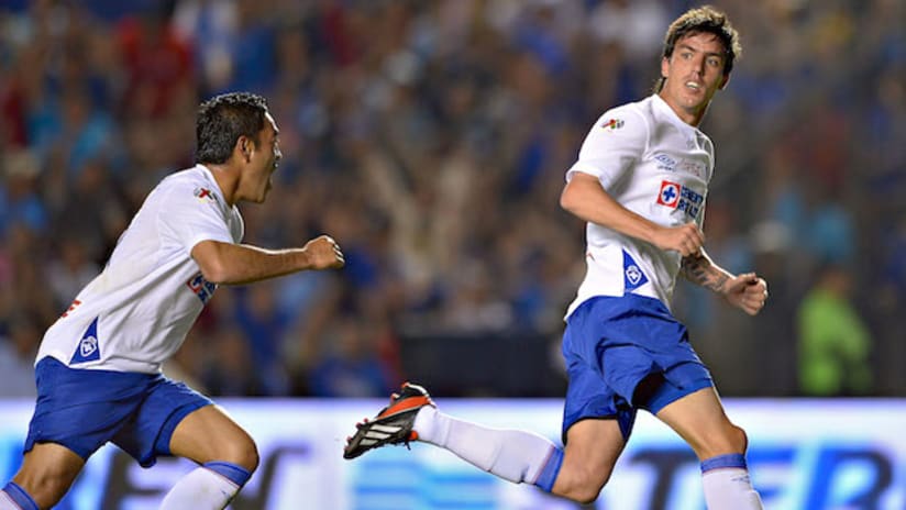 Marco Fabian and Mauro Formica celebrate a goal from Cruz Azul