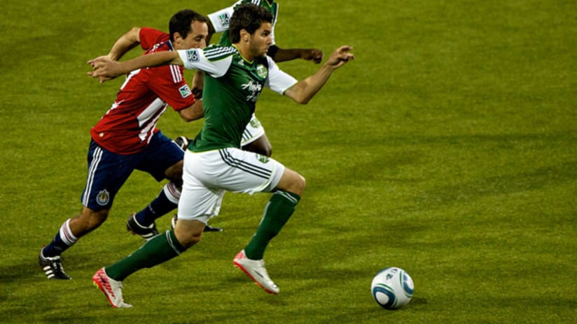 Sal Zizzo of the Portland Timbers outraces Nick LaBrocca of Chivas USA