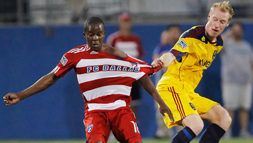 Marvin Chavez of FC Dallas (left) gets pulled by Real Salt Lake's Nat Borchers on Sunday night in Frisco, Texas.
