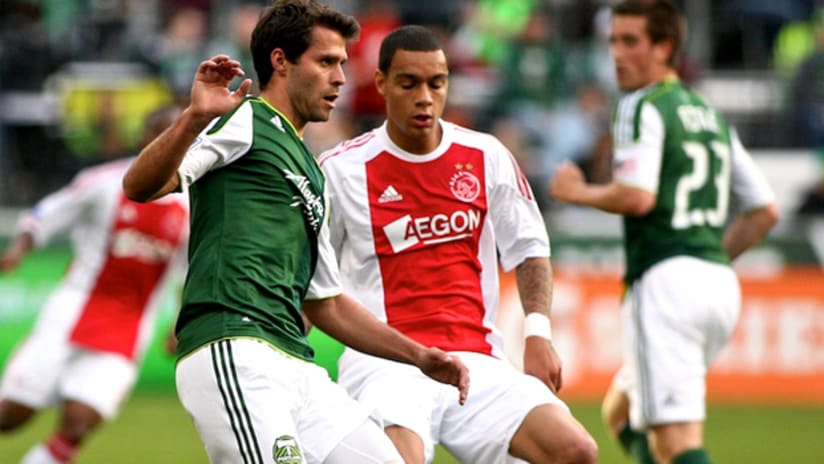 Portland's Peter Lowry takes a touch in a friendly against Ajax.