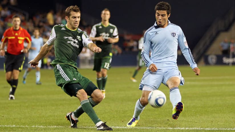 Soony Saad (right) is defended by Eric Brunner.