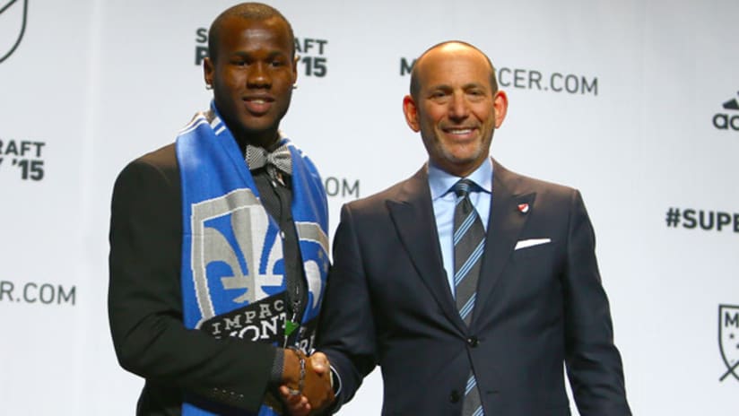 Romario Williams with Don Garber after being taken No. 3 by Montreal Impact in SuperDraft
