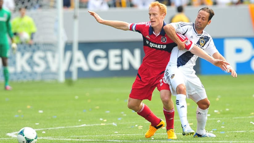 Jeff Larentowicz and Marcelo Sarvas fight for a loose ball