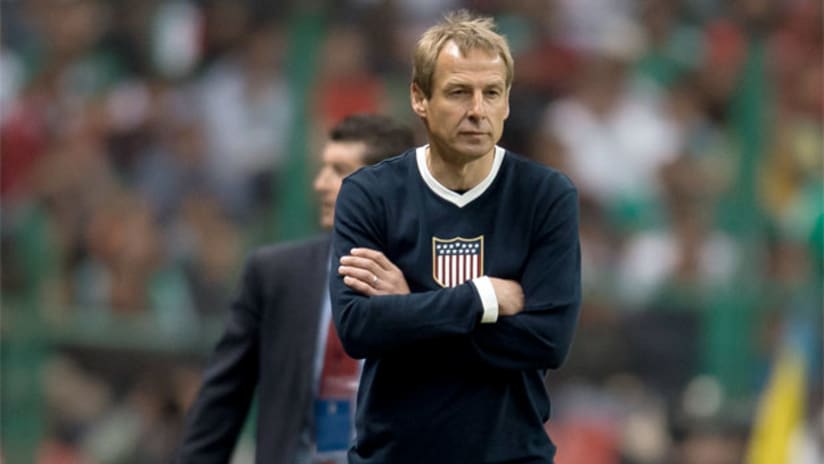 Jurgen Klinsmann walks the sidelines with Chepo de la Torre in the background