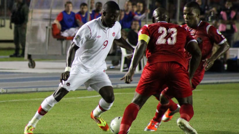 Canada's Tosaint Ricketts takes on Panama players
