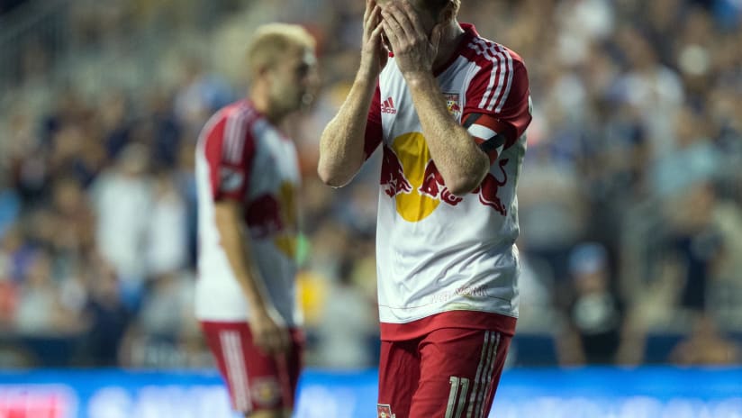 Dax McCarty puts his head in his hands