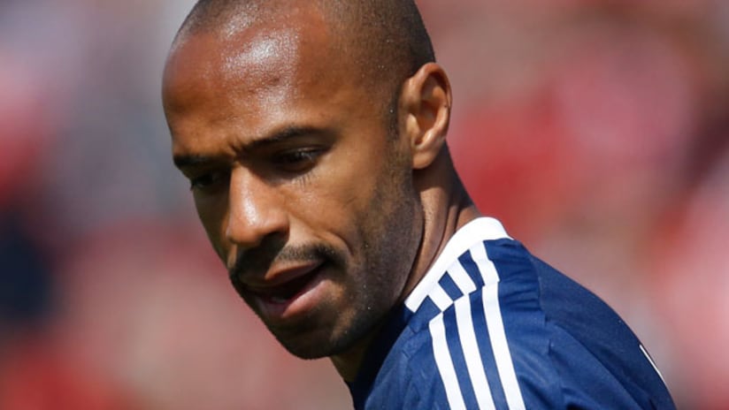Thierry Henry looks down, close up