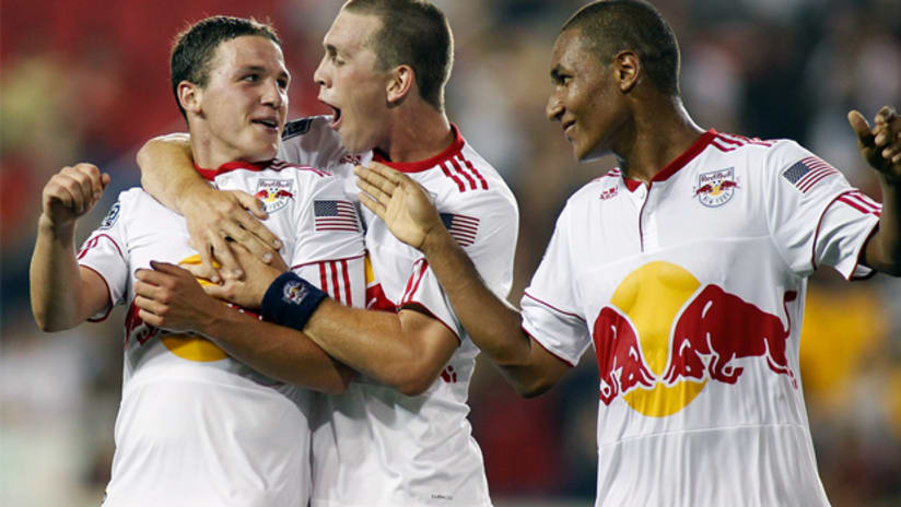 John Rooney (left) celebrates his USOC goal with teammates Corey Hertzog and Juan Agudelo.
