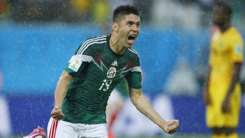 Oribe Peralta celebrates Mexico's opening goal.
