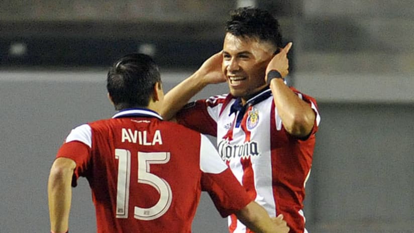 Chivas USA's Carlos Alvarez celebrates his goal with Eric Avila