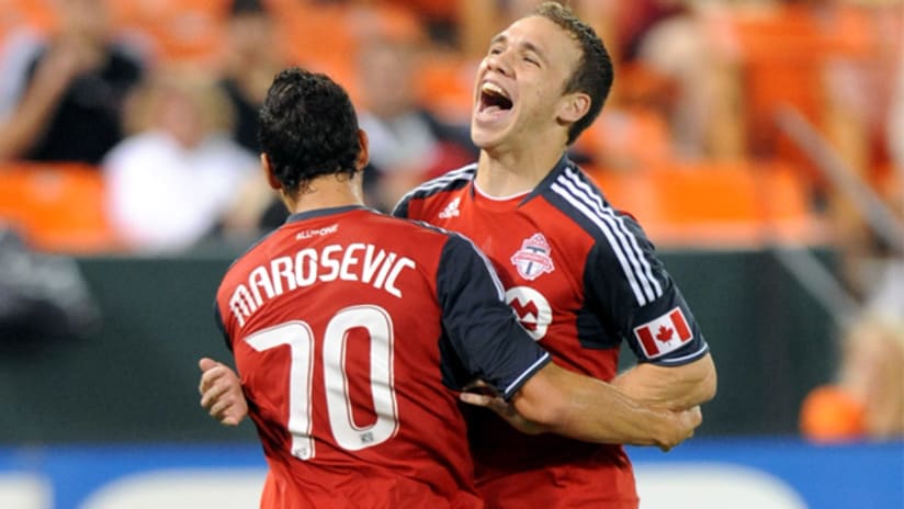 Matt Stinson and Peri Marosevic celebrate a goal from Toronto.