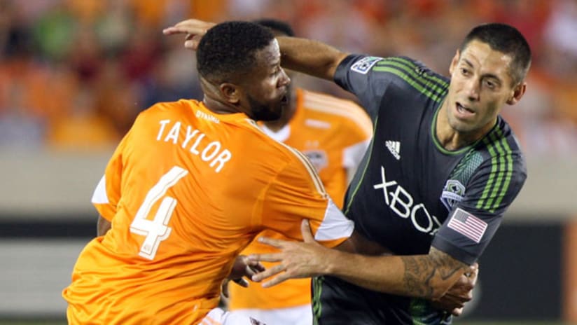 Houston's Jermaine Taylor and Seattle's Clint Dempsey