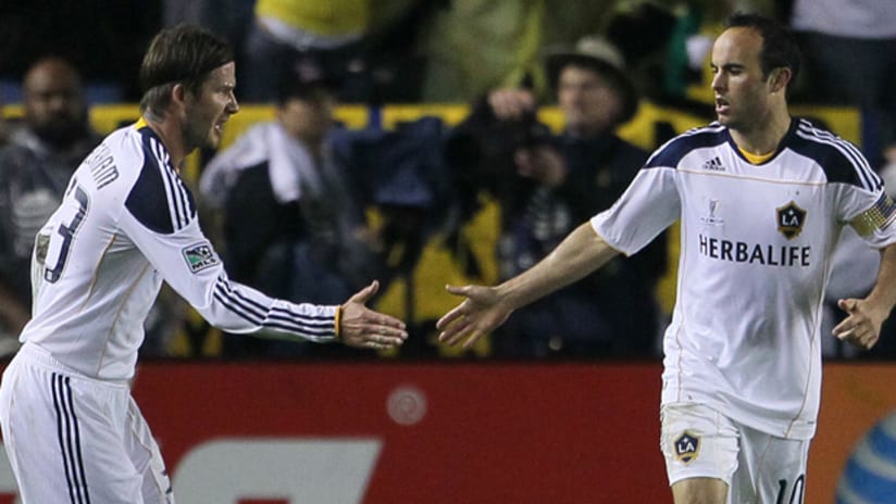 David Beckham and Landon Donovan celebrate the Galaxy's game-winning goal on Sunday in the MLS Cup.