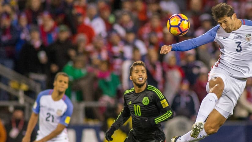 US defender Omar Gonzalez heads it over Mexico's Giovani dos Santos during WC Qualifying - 11/11/16