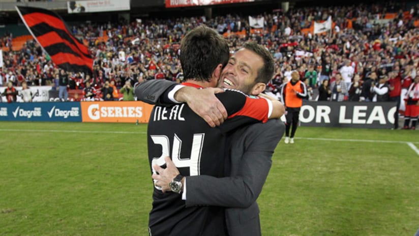 Ben Olsen and Neal embrace after win