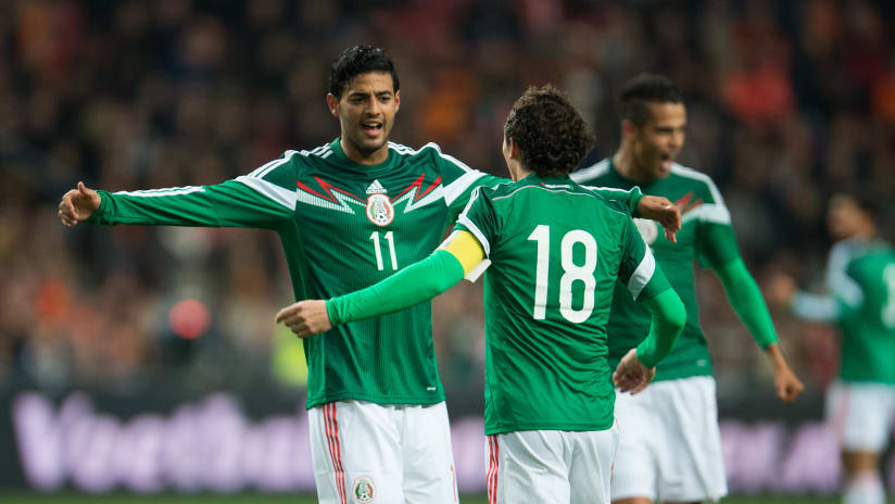Mexico celebrate scoring against the Netherlands