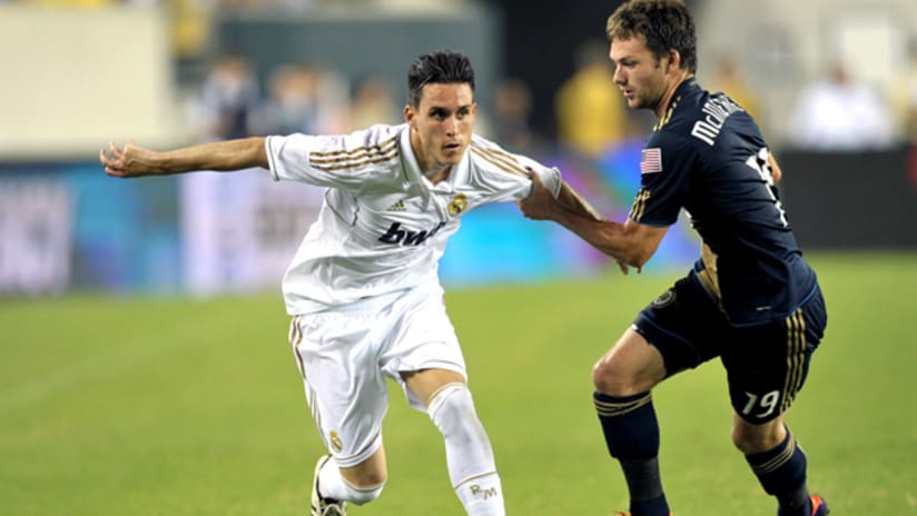 Real Madrid's Jose Maria Callejon tries to get back Philadelphia's Jack McInerney.
