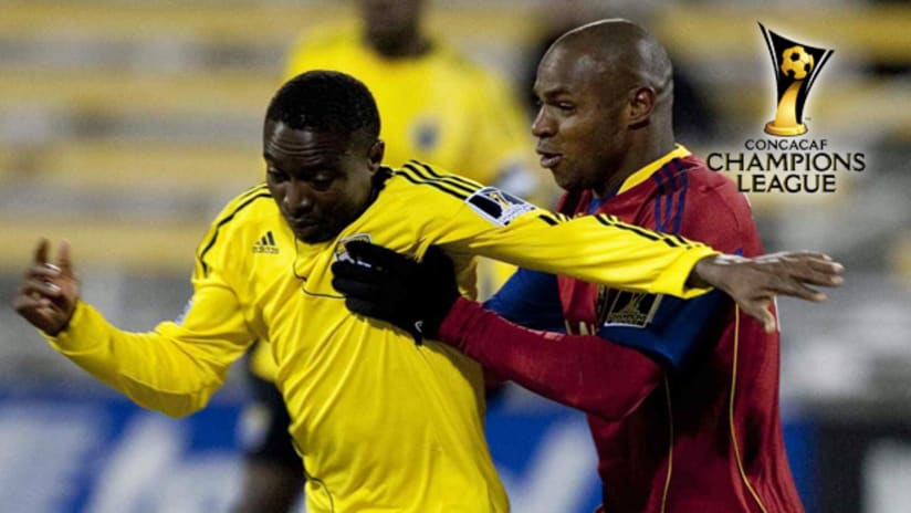 The Crew's Emmanuel Ekpo (left) battles with Real Salt Lake's Jamison Olave on Tuesday night in Columbus.