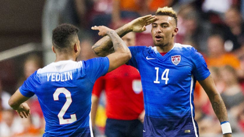 DeAndre Yedlin and Danny Williams salute each other