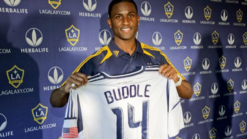 Edson Buddle holds up a LA Galaxy jersey