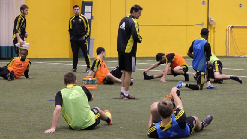 Members of the Columbus Crew stretch during a preseason workout on Thursday