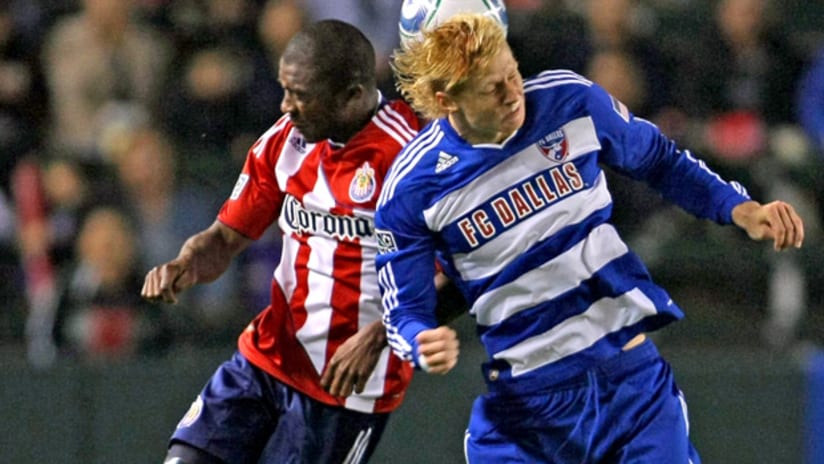 Chivas USA's Michael Lahoud (left) goes up for a header against FC Dallas' Brek Shea.