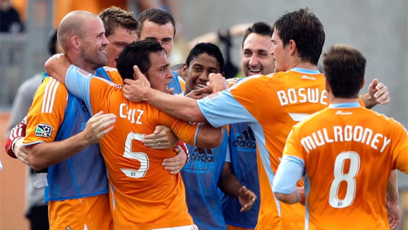 Danny Cruz ran to the sideline to celebrate his first MLS goal with teammates.