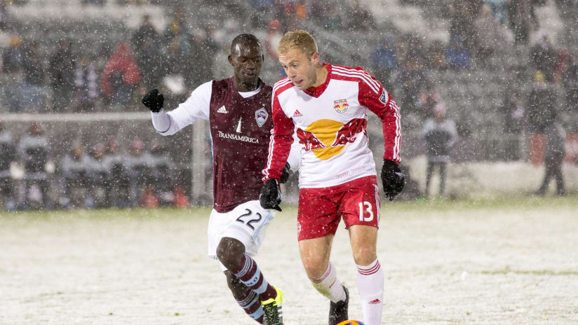 Micheal Azira, Mike Grella - Colorado Rapids, New York Red Bulls - tussle on the snow-covered field