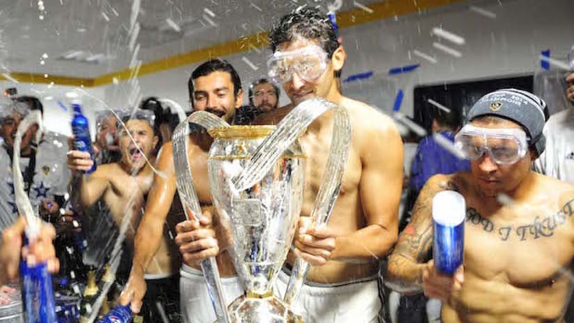Omar Gonazlez celebrating with LA Galaxy's 2014 MLS Cup trophy