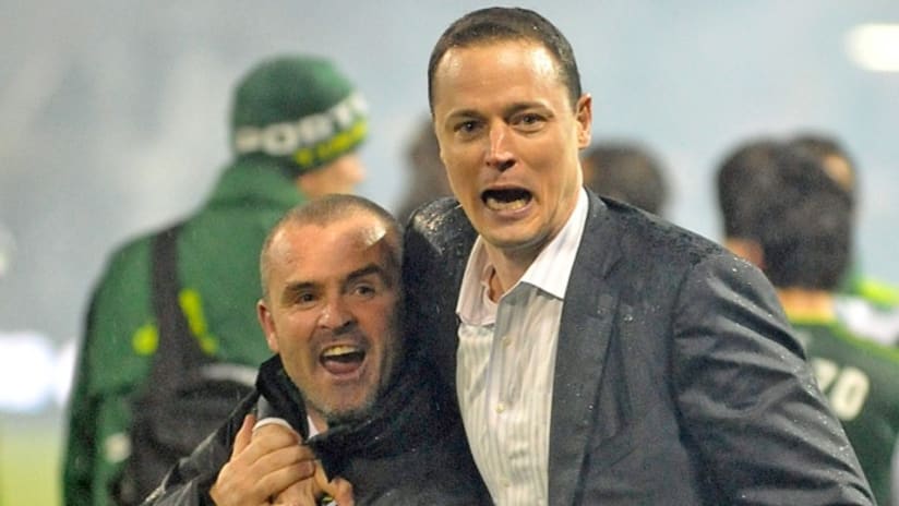 Portland Timbers owner Merritt Paulson (right) embraces head coach John Spencer after the team's win in their home opener on April 14.