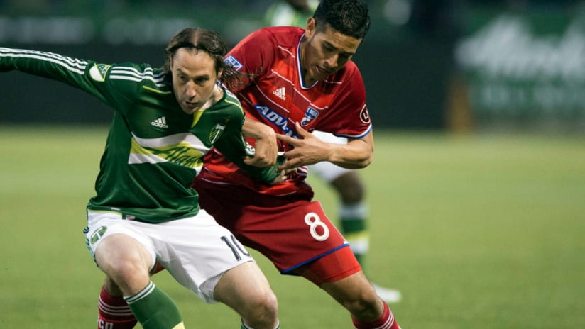Ned Grabavoy (Portland Timbers) battles Victor Ulloa (FC Dallas) for the ball