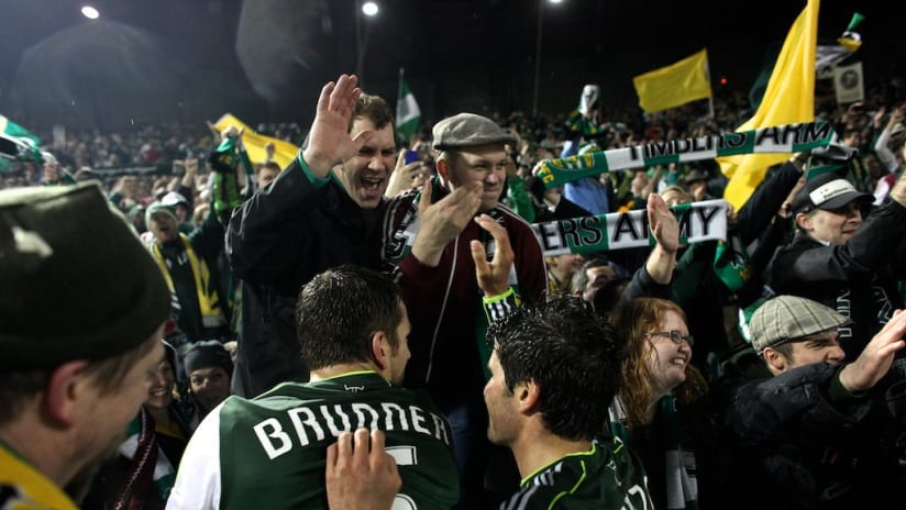 Members of the Timbers Army greet players after Portland's 4-2 win over the Chicago Fire on Thursday night in Portland.