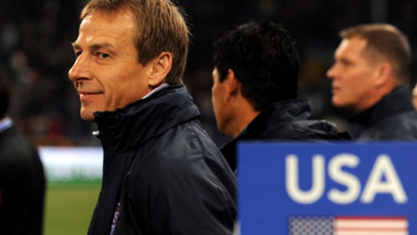 Jurgen Klinsmann smiles as looks on during the US' 1-0 victory over Italy