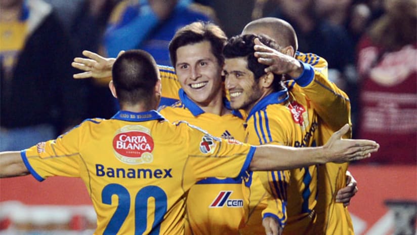 Jose Torres celebrates with his Tigres teammates
