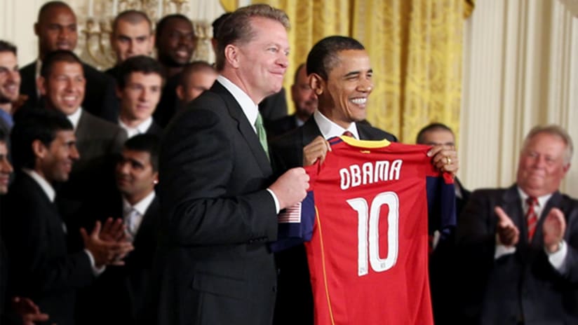 Real Salt Lake Chairman Dave Checketts hands President Obama a personalized RSL jersey.