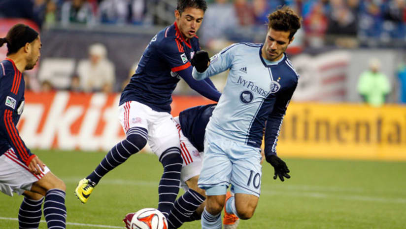 Sporting KC's Benny Feilhaber and New England's Diego Fagundez battle