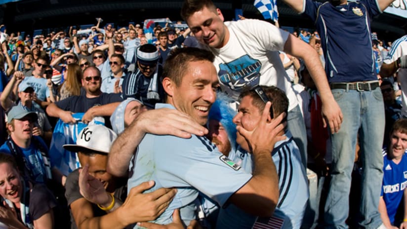 Davy Arnaud celebrates with Sporting Kansas City fans during a match in 2011.