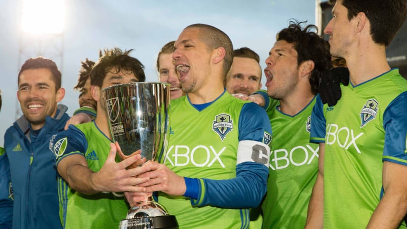 Ozzie Alonso - Seattle Sounders - Holds Western Conference Championship trophy with teammates