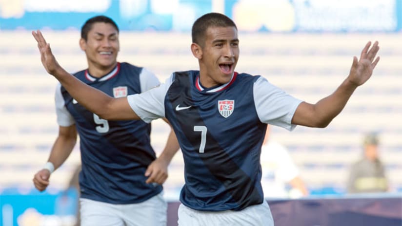 Jose Villarreal celebrates his goal for the US as Mario Rodriguez looks on