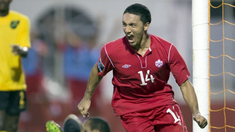 Canada's Eric Gordon celebrates a goal on Jamaica