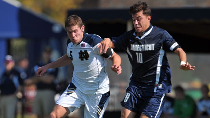 Dillon Powers of Notre Dame and Carlos Alvarez of UConn tussle