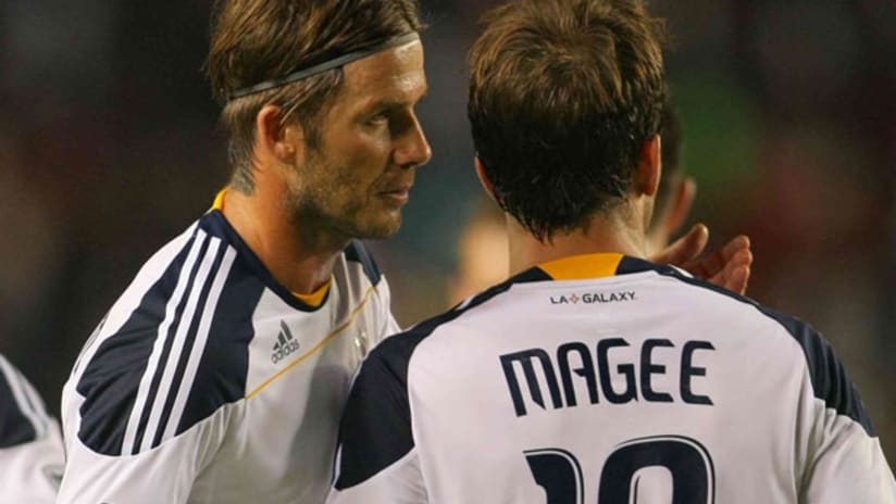 LA Galaxy's David Beckham gives instructions to Mike Magee.