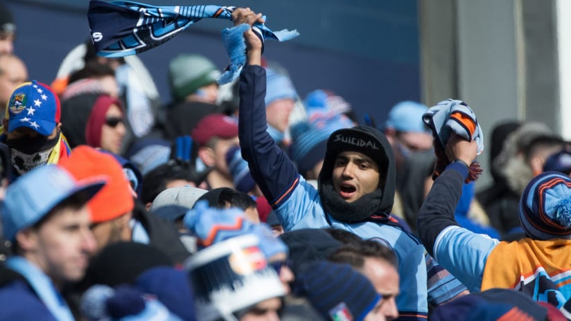 New York City FC fan waving scarf - supporters groups section - Yankee Stadium