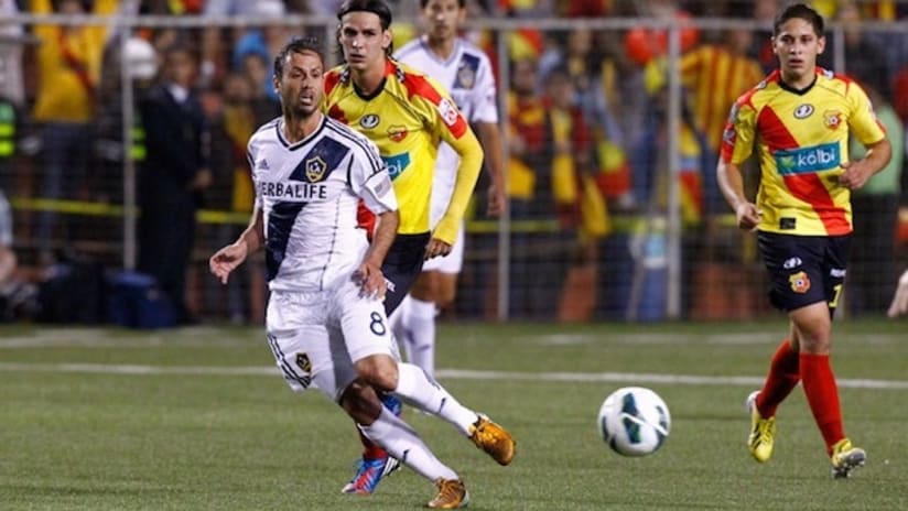 LA Galaxy's Marcelo Sarvas passes the ball against Herediano
