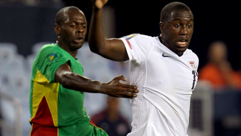 The United States' Jozy Altidore gets by Guadeloupe's Eddy Viator.