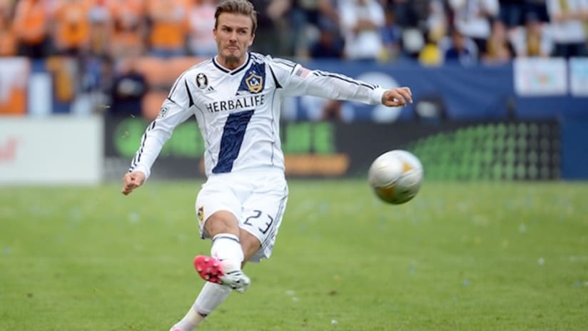 David Beckham kicks a ball